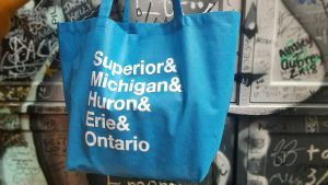 Blue bag with white text listing the names of the Great Lakes